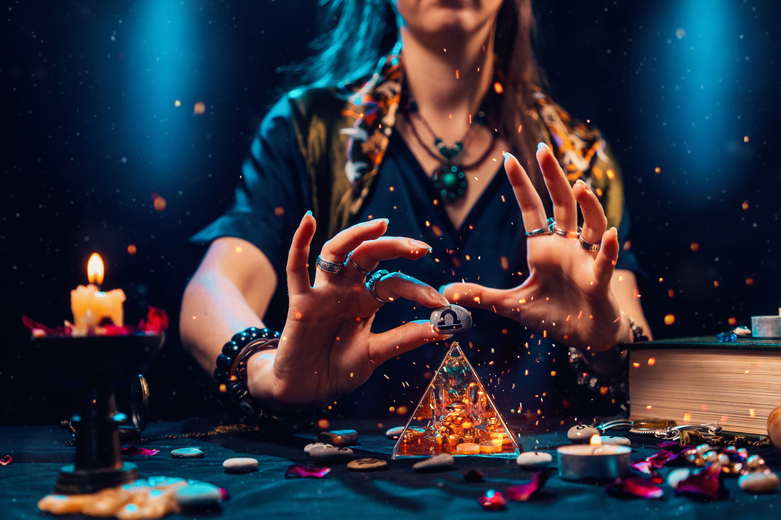 Astrology and Horoscope. a Witch Holds a Stone with the Sign of the Zodiac Libra. Close up. the Concept of Divination and Magic